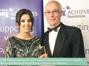 Dally Purewal receives the Achievement in Education Award from Stephen Burwood of Positive Tax Solutions LLP